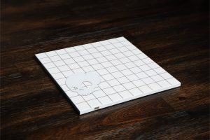 A white battle mat with a skull on it.