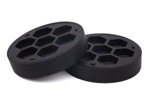 Two black plastic lids with holes on them.