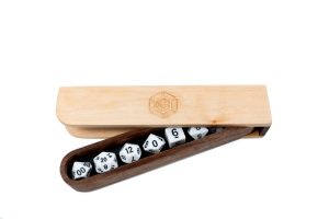 A set of wooden dice in a wooden box.