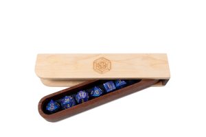 A wooden box with a set of dice in it.