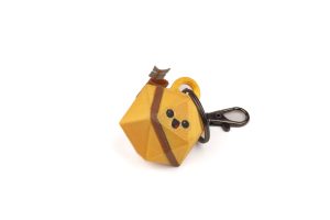 A yellow key ring with a cat on it.