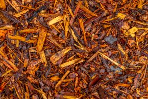 A close up of a pile of brown mulch.