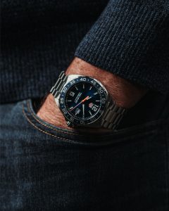 A man wearing a watch in his pocket.